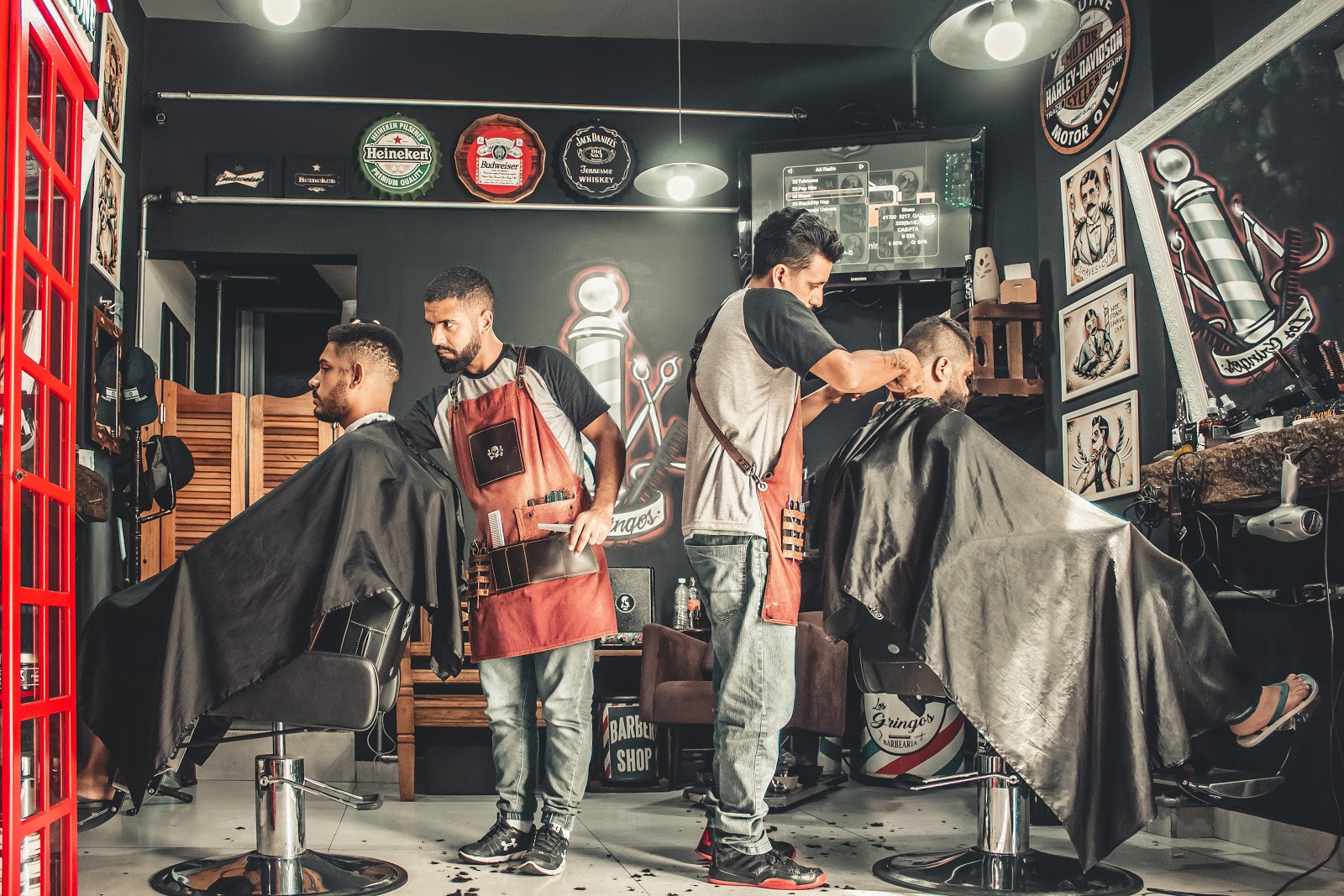 Two barbers working in a barber shop