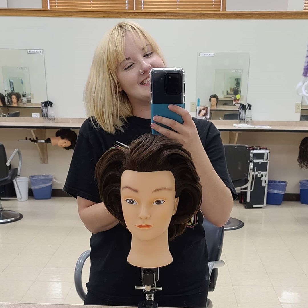 student practicing on a mannequin