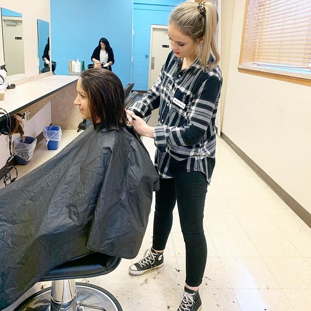 student working with client